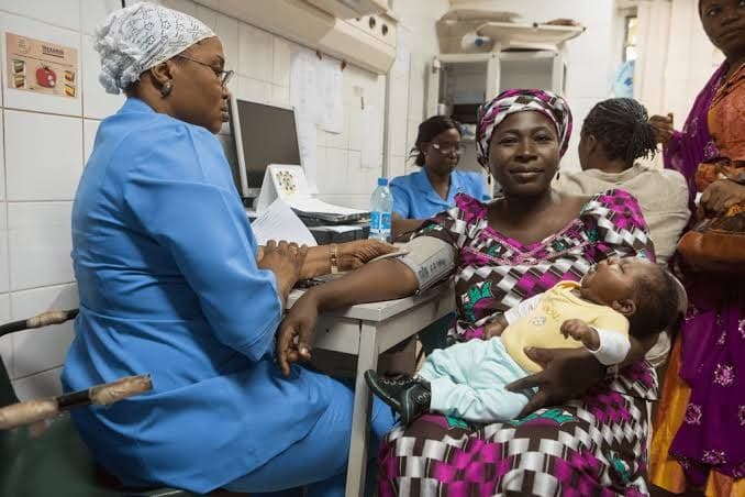 Mother and infant receiving free clinical care supported by Reliable Sisters Relief Foundation